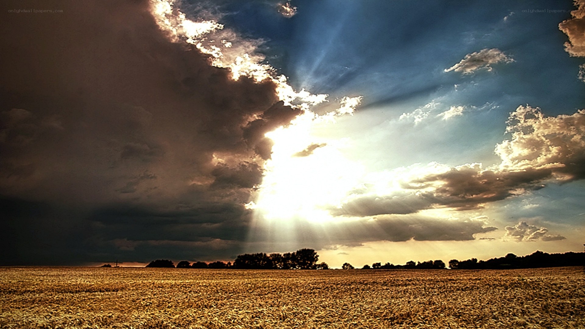 Sunlight breaks through storm clouds