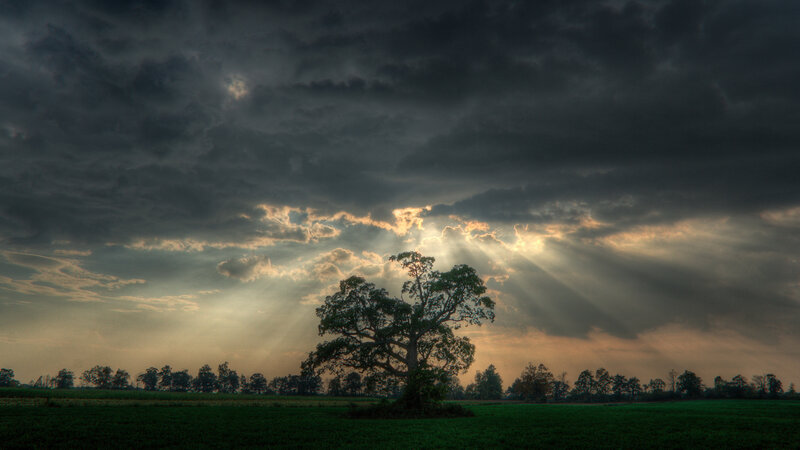 Sunlight breaks through storm clouds