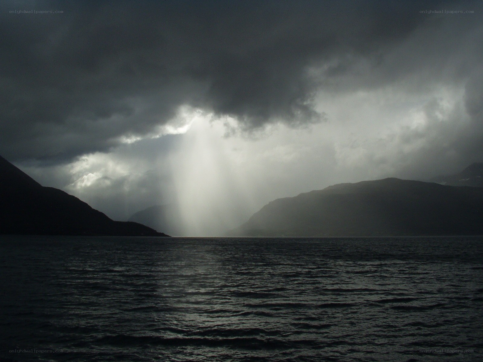Sunlight breaks through storm clouds