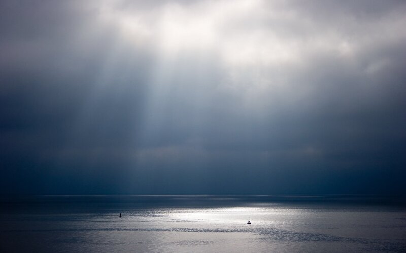 Sunlight breaks through storm clouds