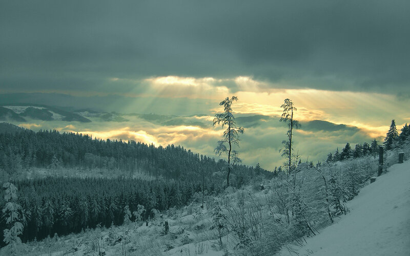 Sunlight breaks through winter clouds