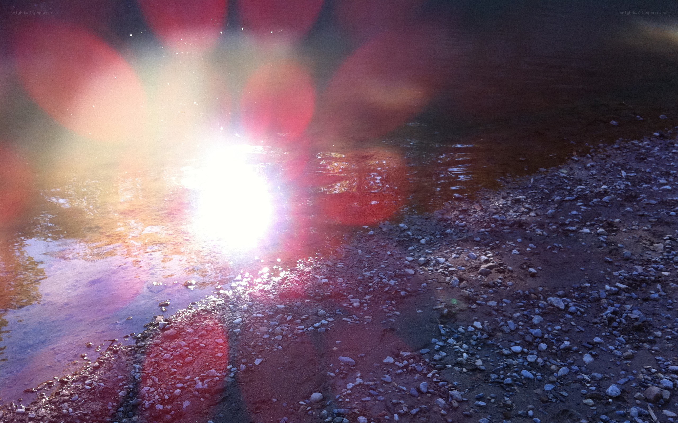 Sunlight on a pebbled shore
