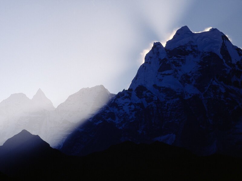 Sunlight on snow-capped mountains