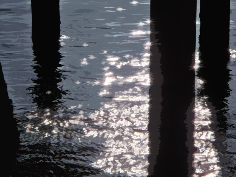 Sunlight on water under pier