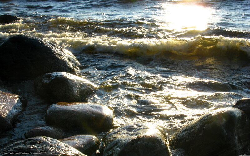 Sunlight on waves and rocks