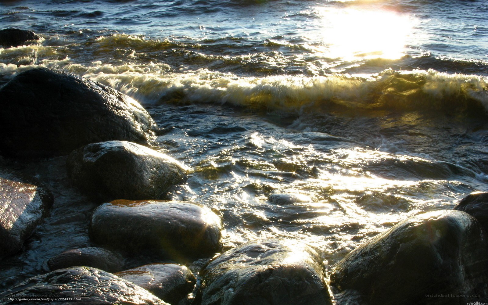 Sunlight on waves and rocks