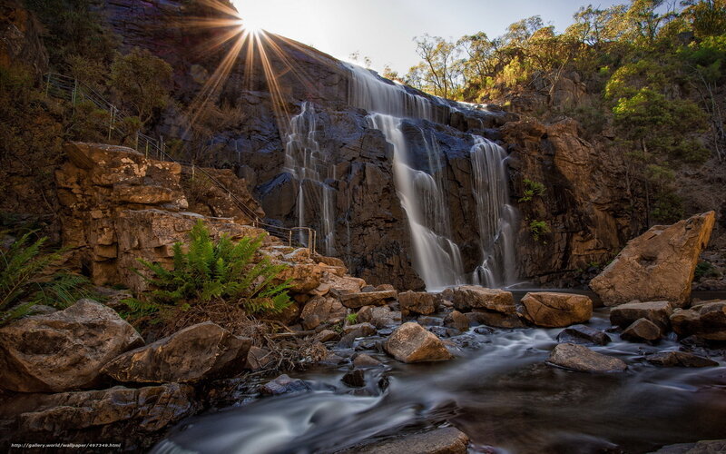 Sunlight over a cascading waterfall