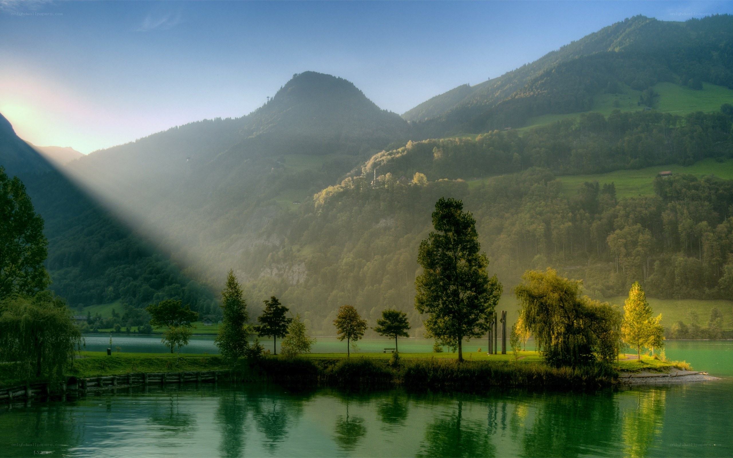 Sunlight over a mountain lake