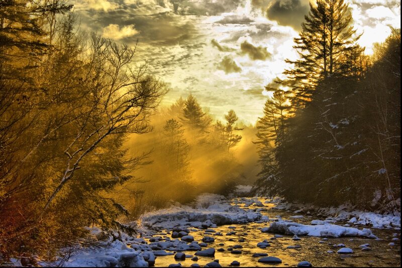 Sunlight over a snowy river