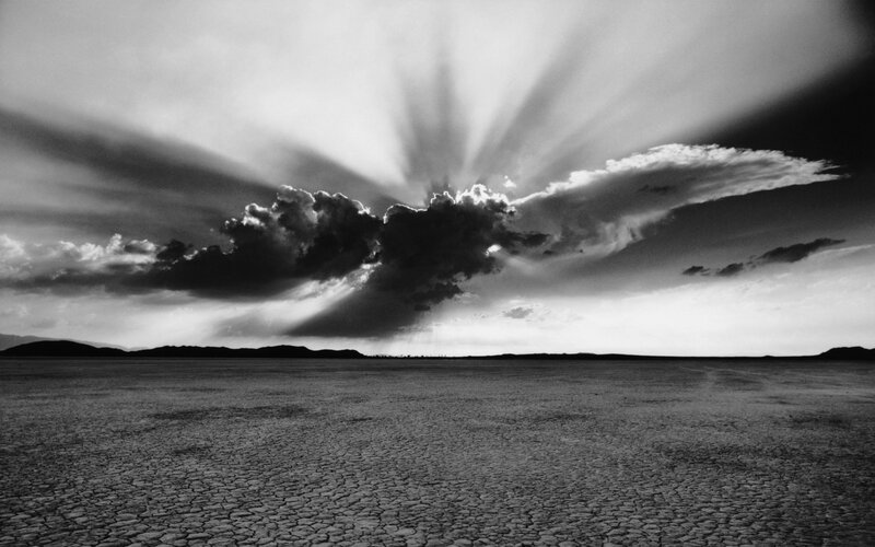 Sunlight over cracked earth