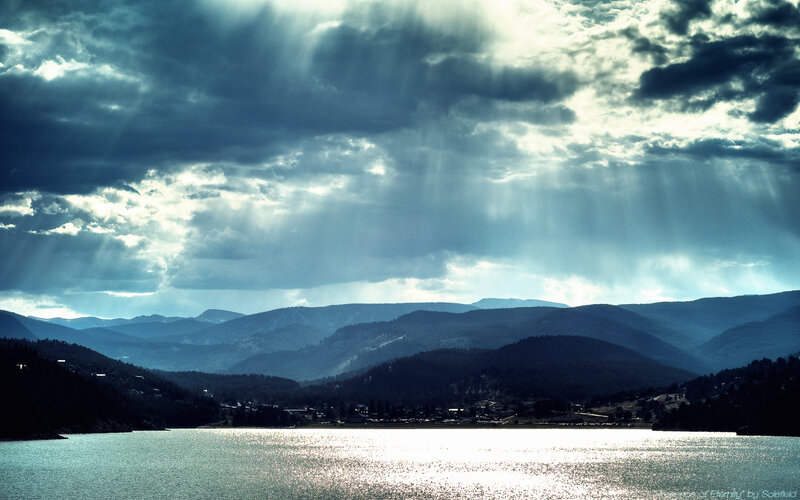 Sunlight over Lake and Mountains