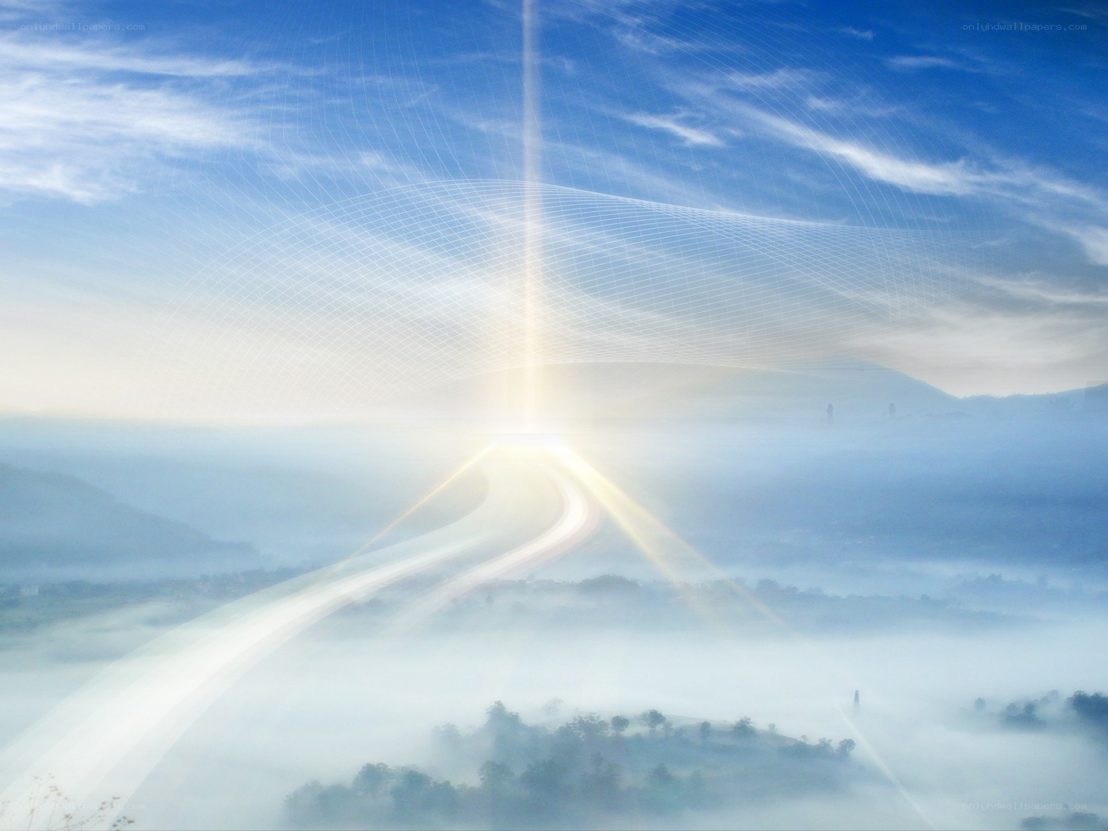 Sunlight over misty valley