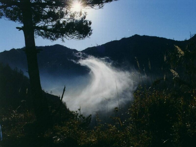 Sunlight over mountain mist