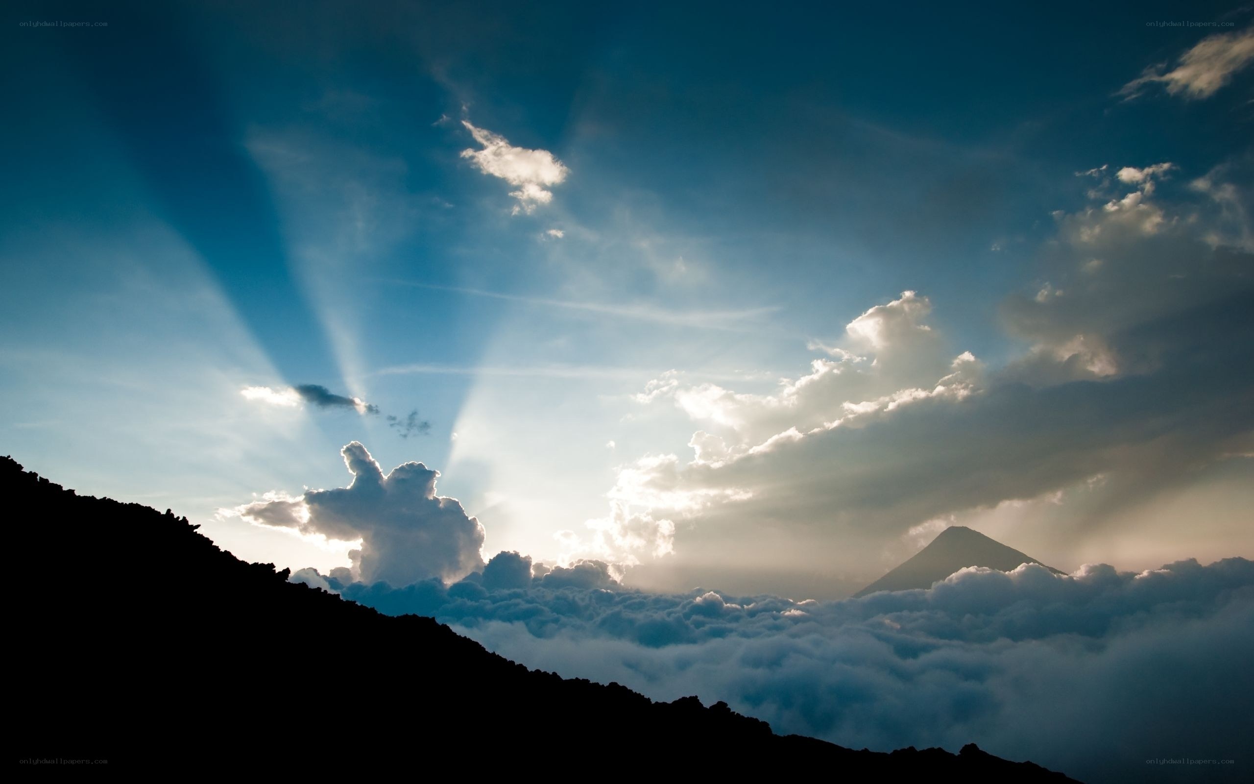 Sunlight over mountain peaks