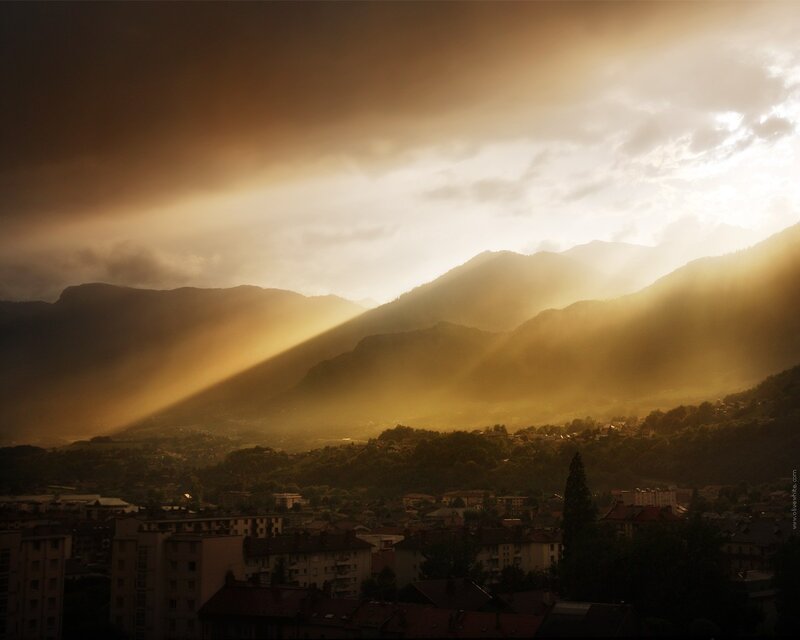 Sunlight over mountain town