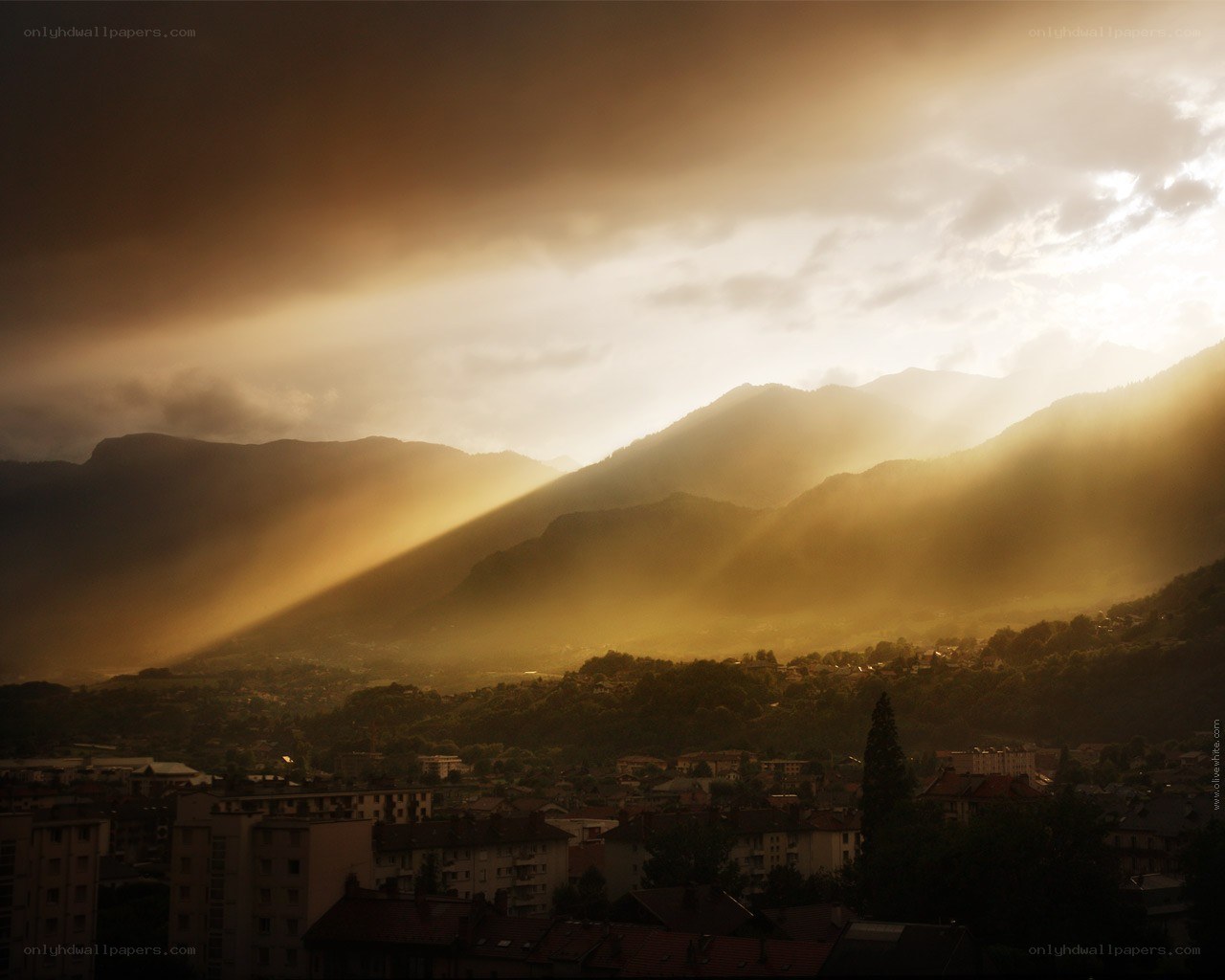 Sunlight over mountain town