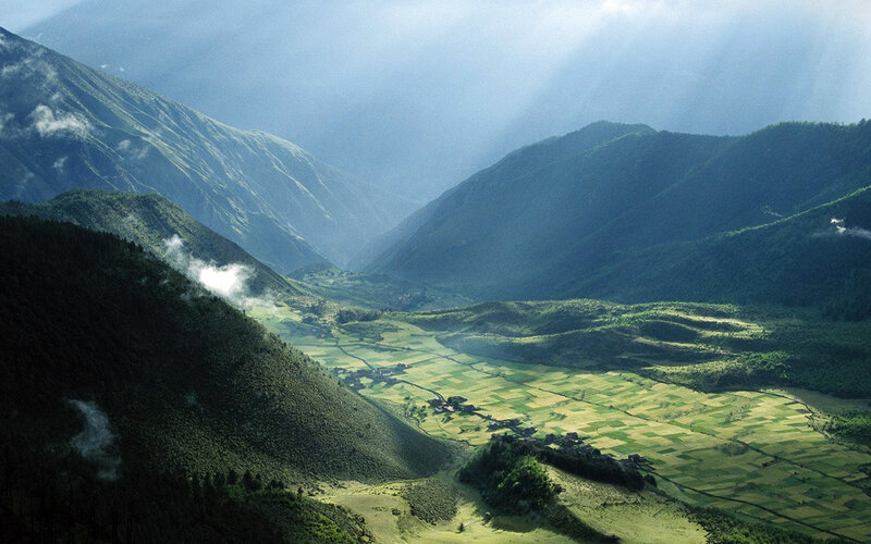 Sunlight over mountain valley
