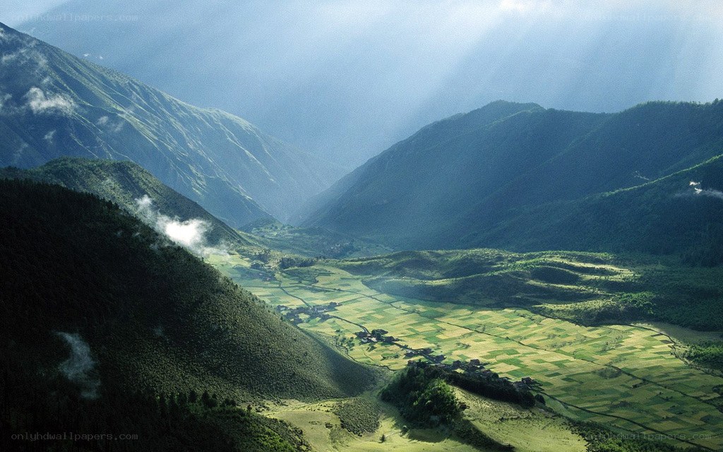 Sunlight over mountain valley