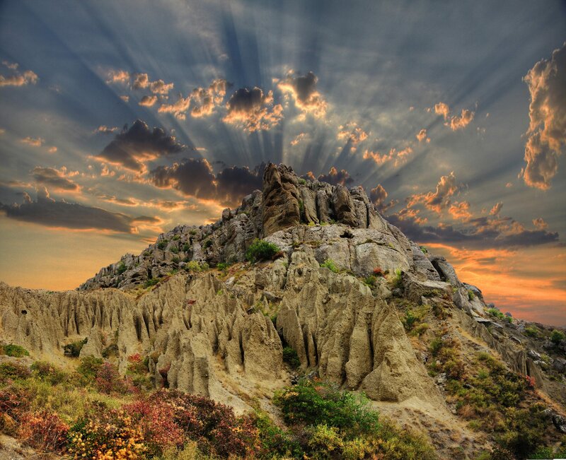 Sunlight over rocky mountain