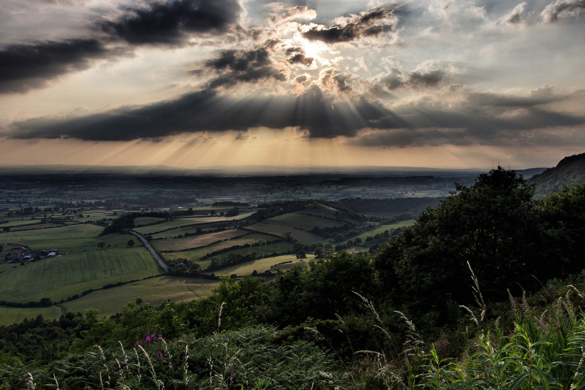 Sunlight over rolling hills