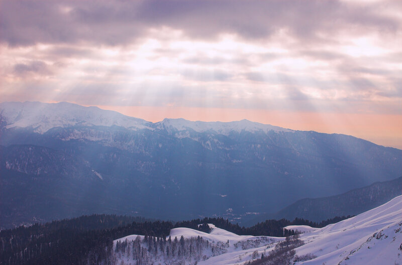 Sunlight over snow-covered mountains