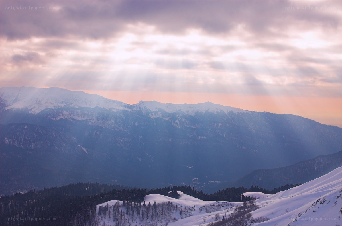 Sunlight over snow-covered mountains