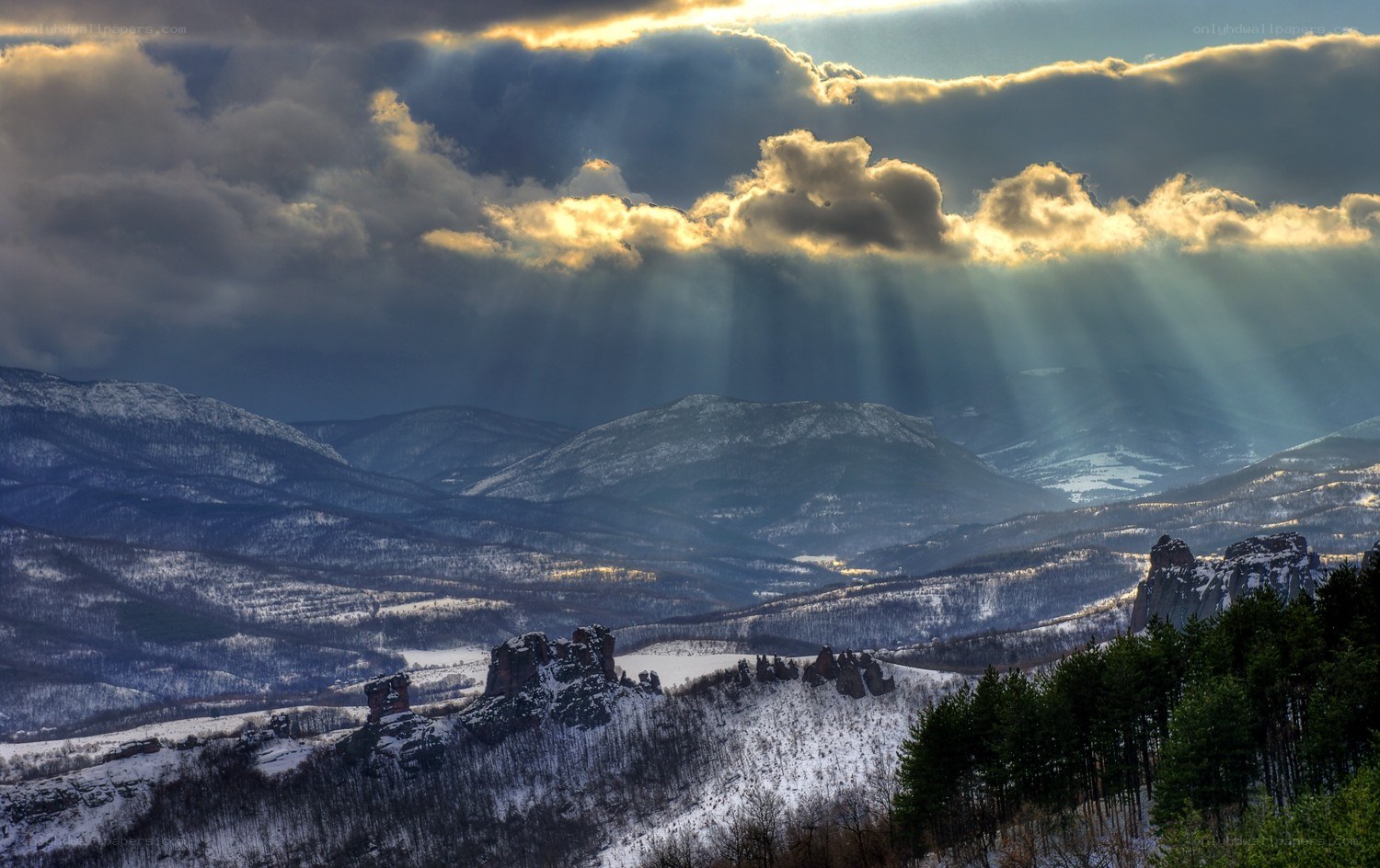 Sunlight over snowy mountains