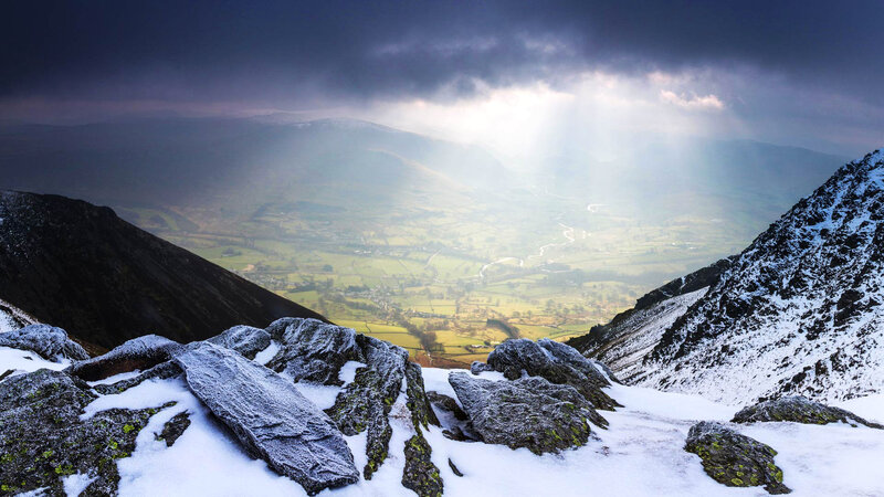 Sunlight over snowy mountains