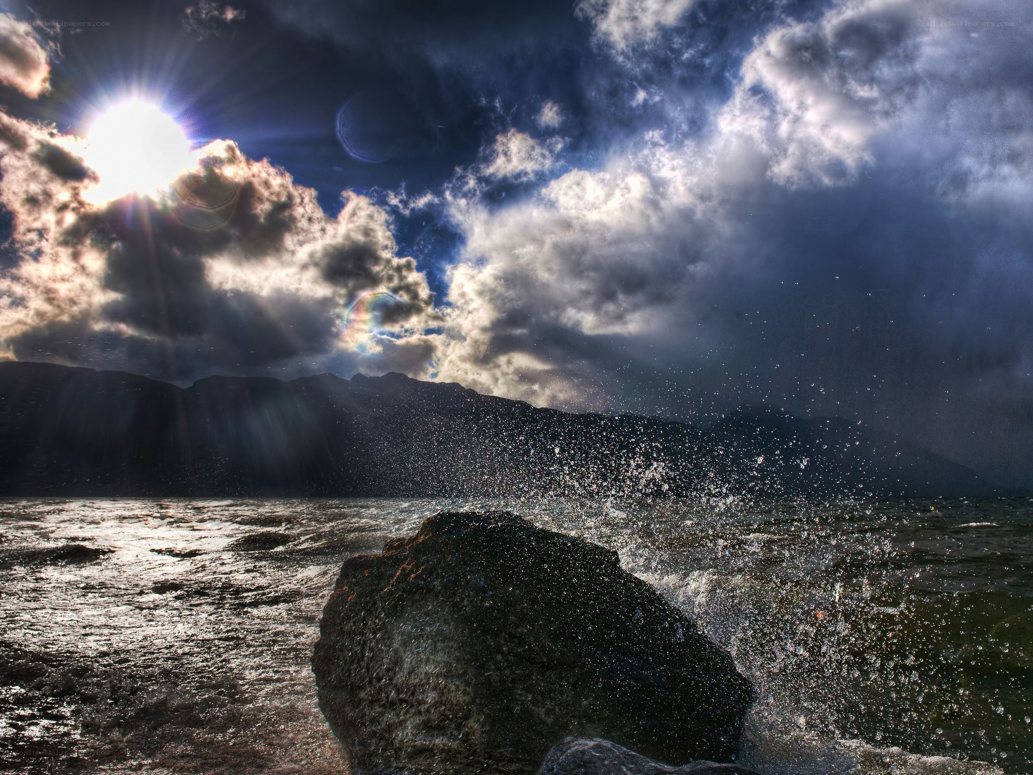 Sunlight over stormy sea