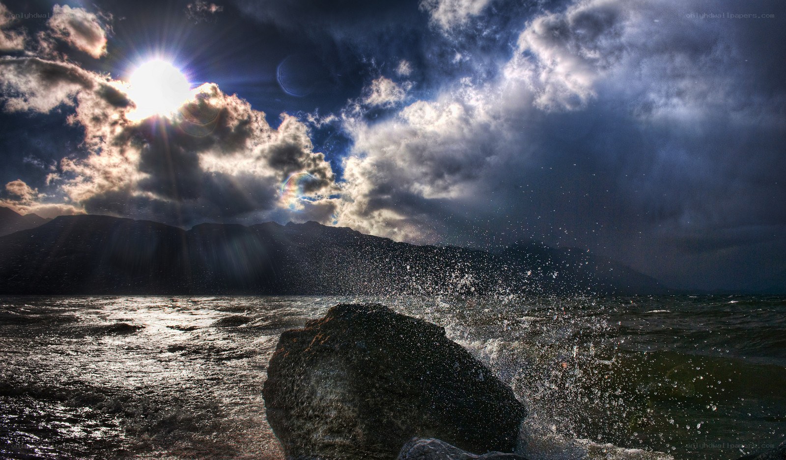 Sunlight over stormy sea