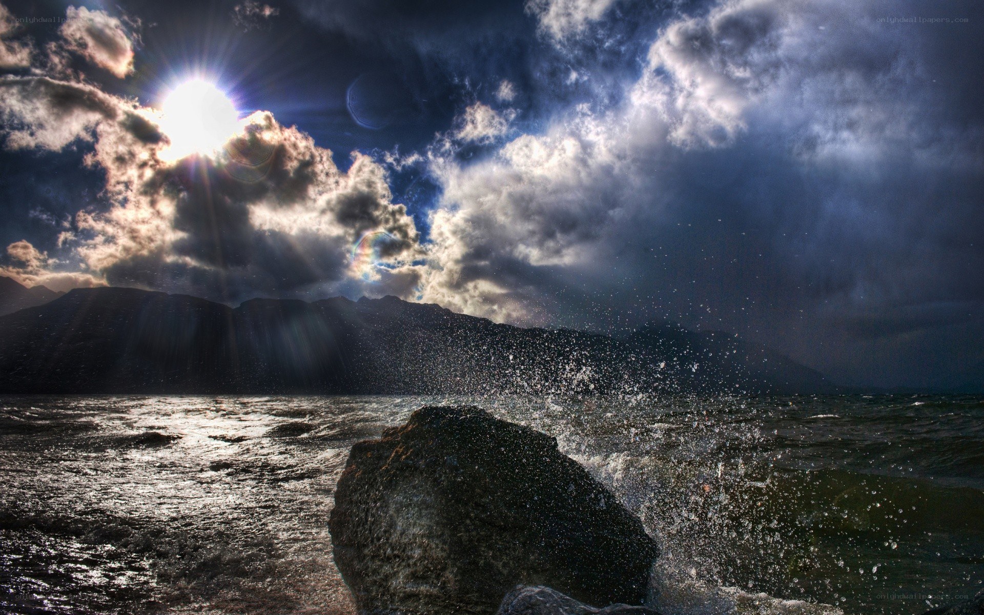 Sunlight over stormy sea