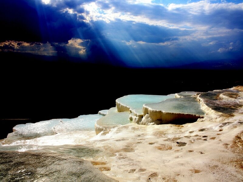 Sunlight over travertine terraces