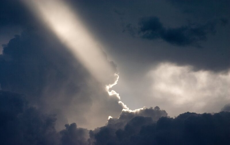 Sunlight piercing storm clouds