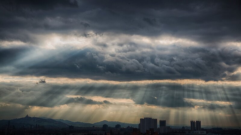 Sunlight piercing storm clouds
