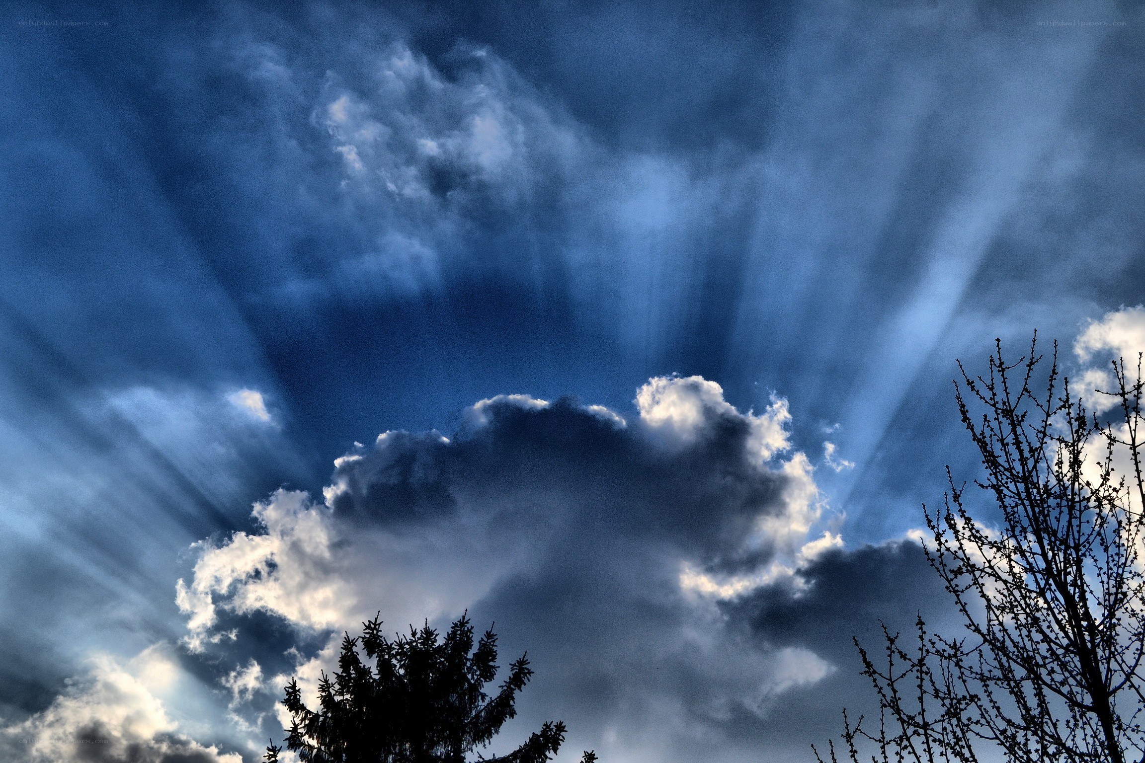 Sunlight piercing storm clouds