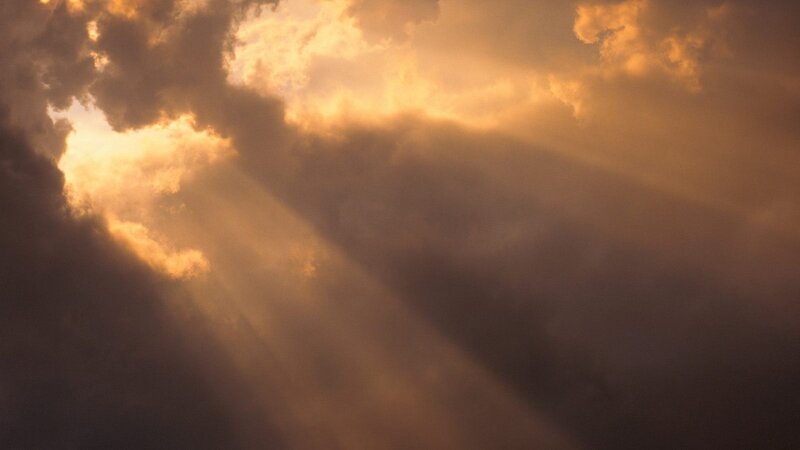 Sunlight piercing through clouds