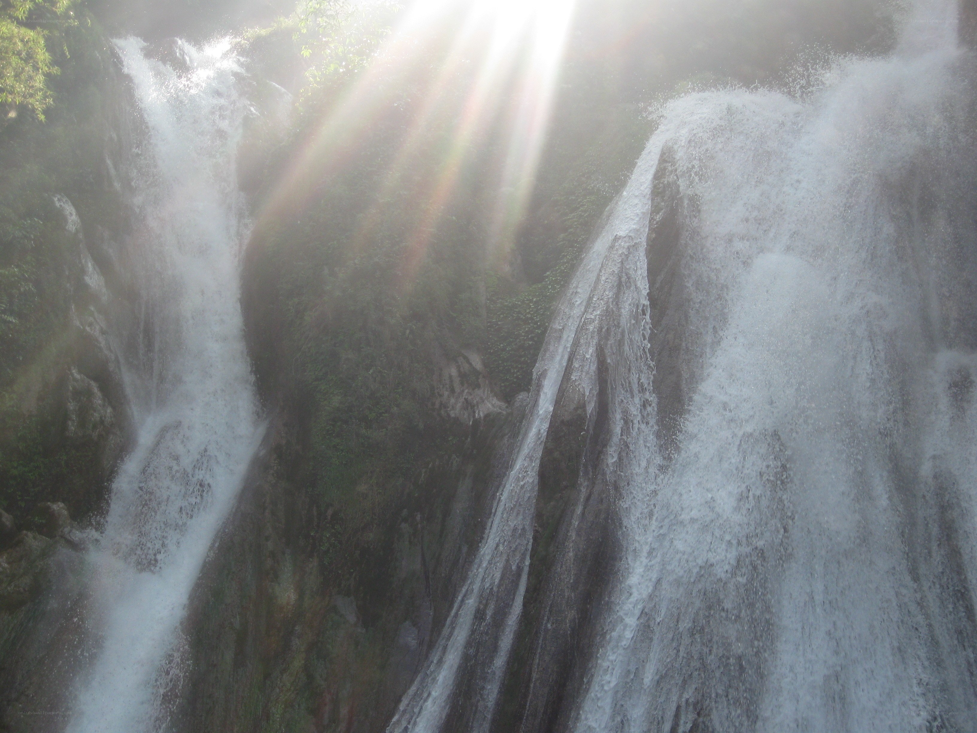 Sunlight through a waterfall