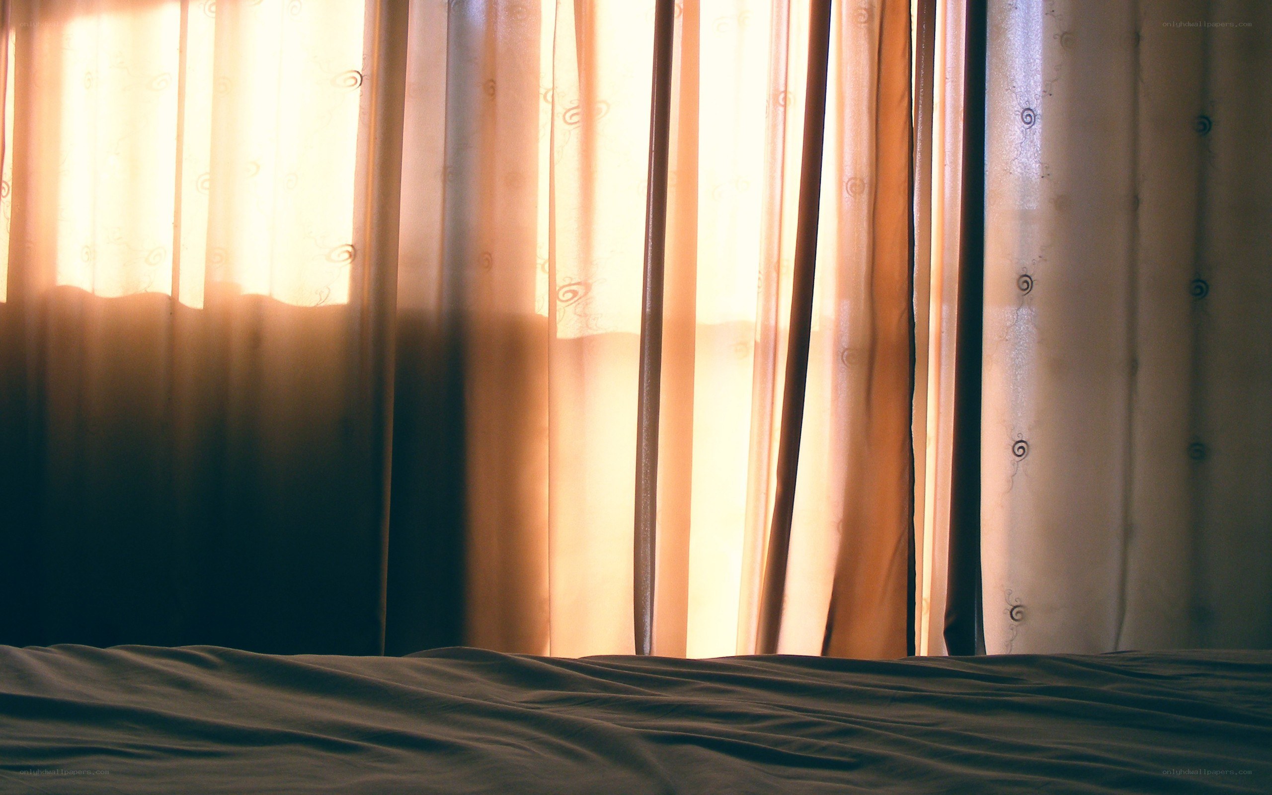 Sunlight through bedroom curtains
