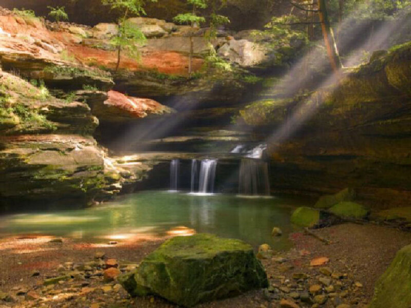 Sunlight through canyon waterfall