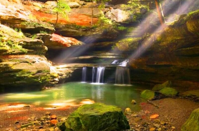 Sunlight through canyon waterfall