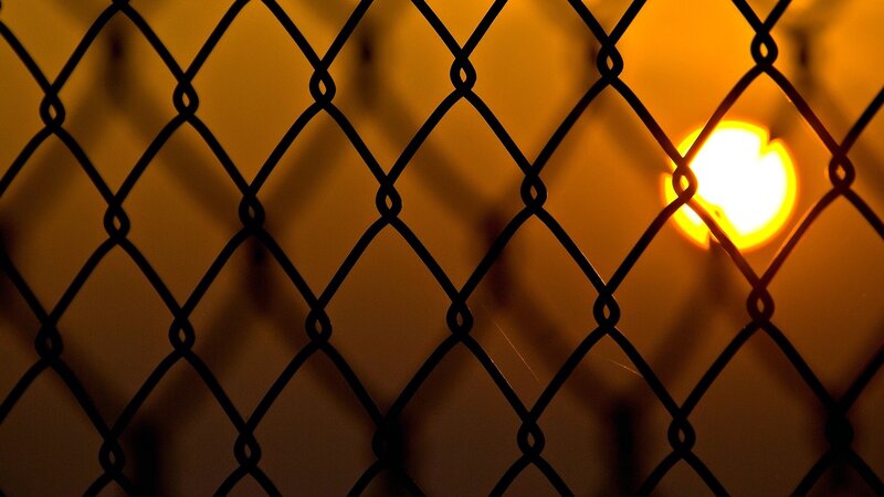 Sunlight through chain-link fence