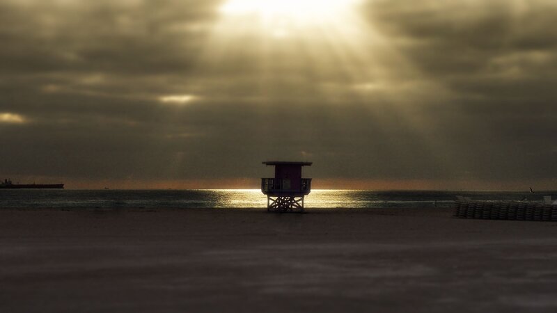 Sunlight through clouds at beach