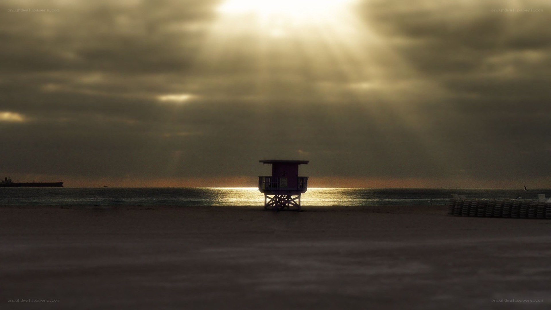 Sunlight through clouds at beach