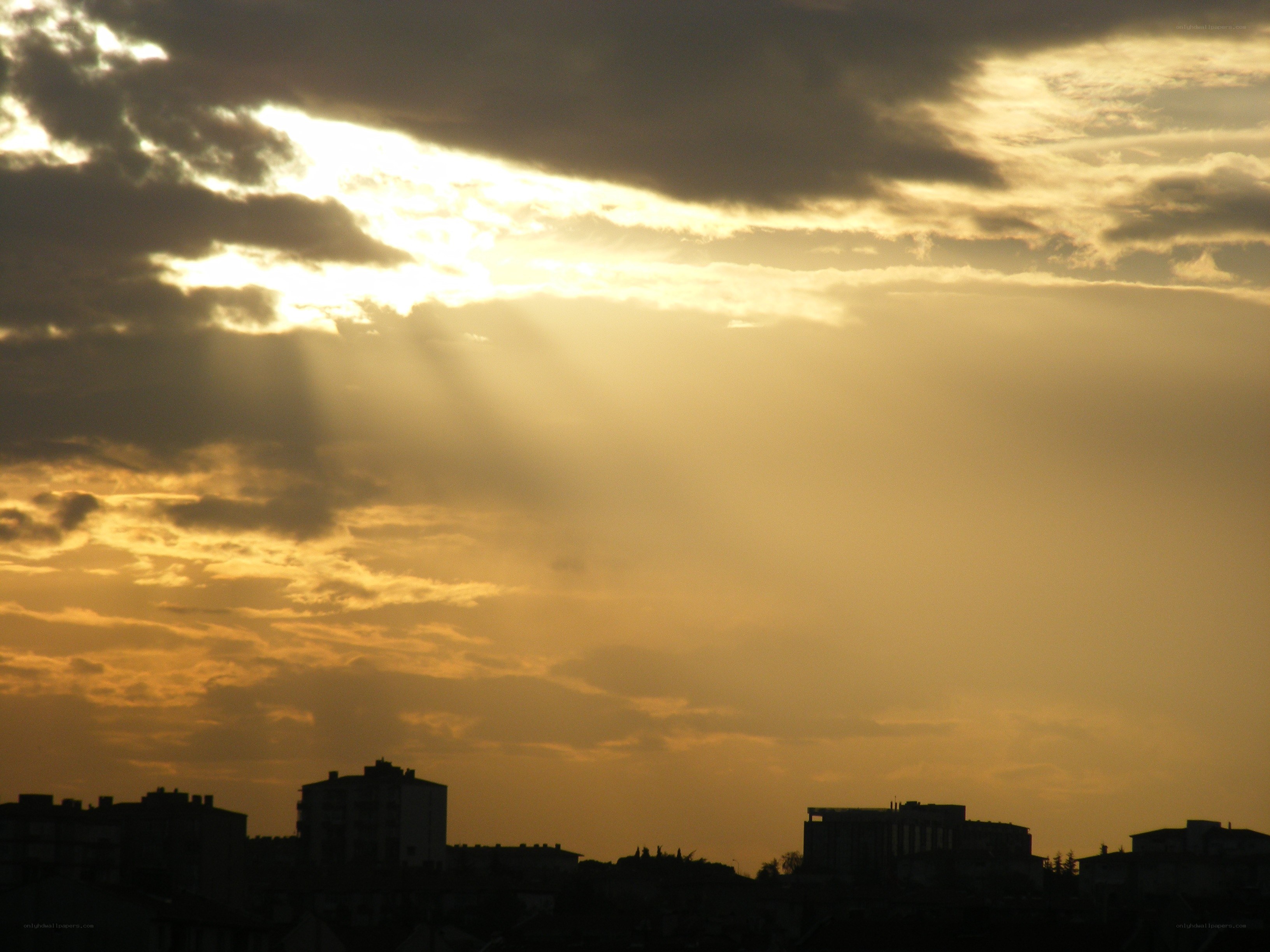 Sunlight through clouds at dusk