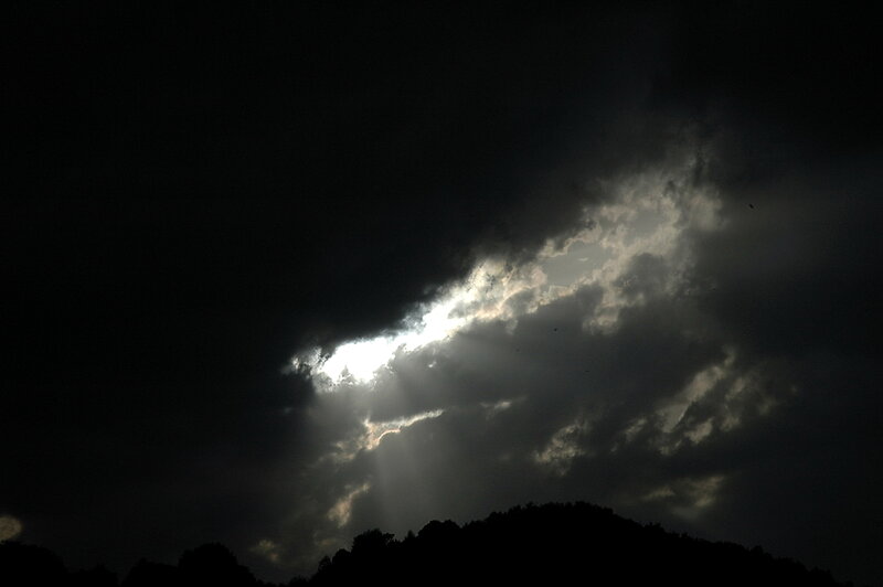 Sunlight Through Clouds — Black, Dramatic