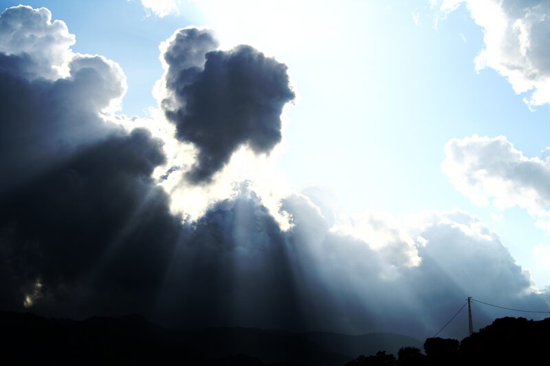 Sunlight Through Clouds — Blue, Dramatic, Afternoon, Photograph, Mountains, Power Line