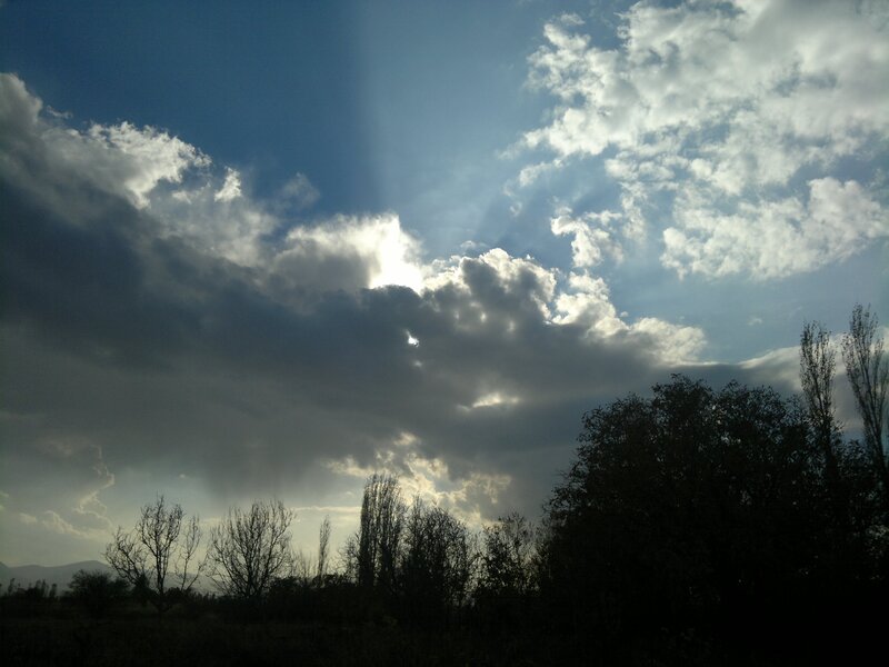 Sunlight Through Clouds — Blue, Dramatic, Afternoon, Photograph, Trees, Mountains