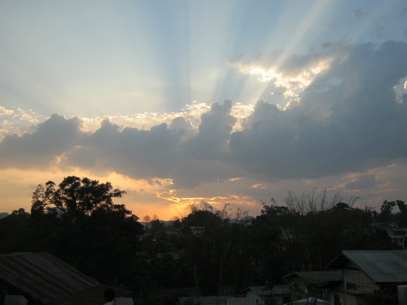 Sunlight Through Clouds — Blue, Dramatic, Sunset, Photograph, Trees, Roofs