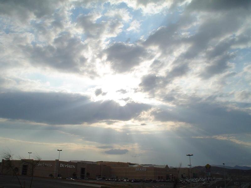 Sunlight Through Clouds — Gray, Dramatic, Afternoon, Photograph, Storefronts