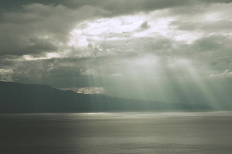 Sunlight Through Clouds — Gray, Dramatic, Photograph